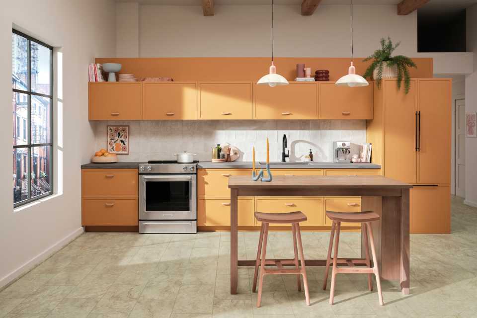 stone look luxury vinyl tile in modern kitchen with orange cabinetry